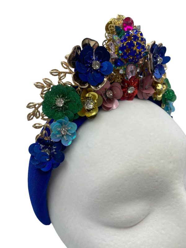 Stunning blue velvet headpiece with an array of coloured embellishments.